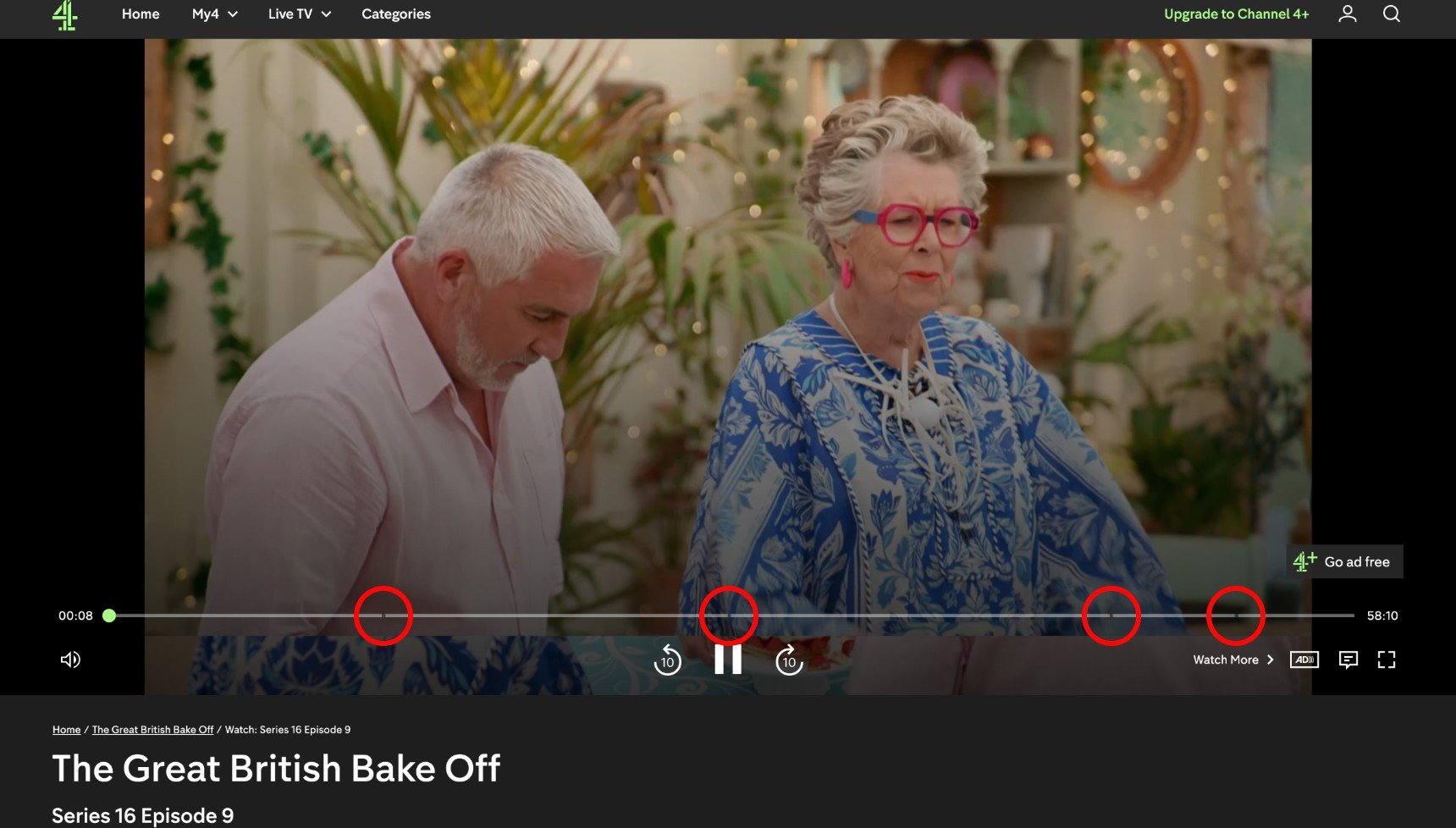 A screenshot of Paul Hollywood and Prue Leith on Great British Bake Off as it plays on Channel 4's website, with four circles on the ad breaks 