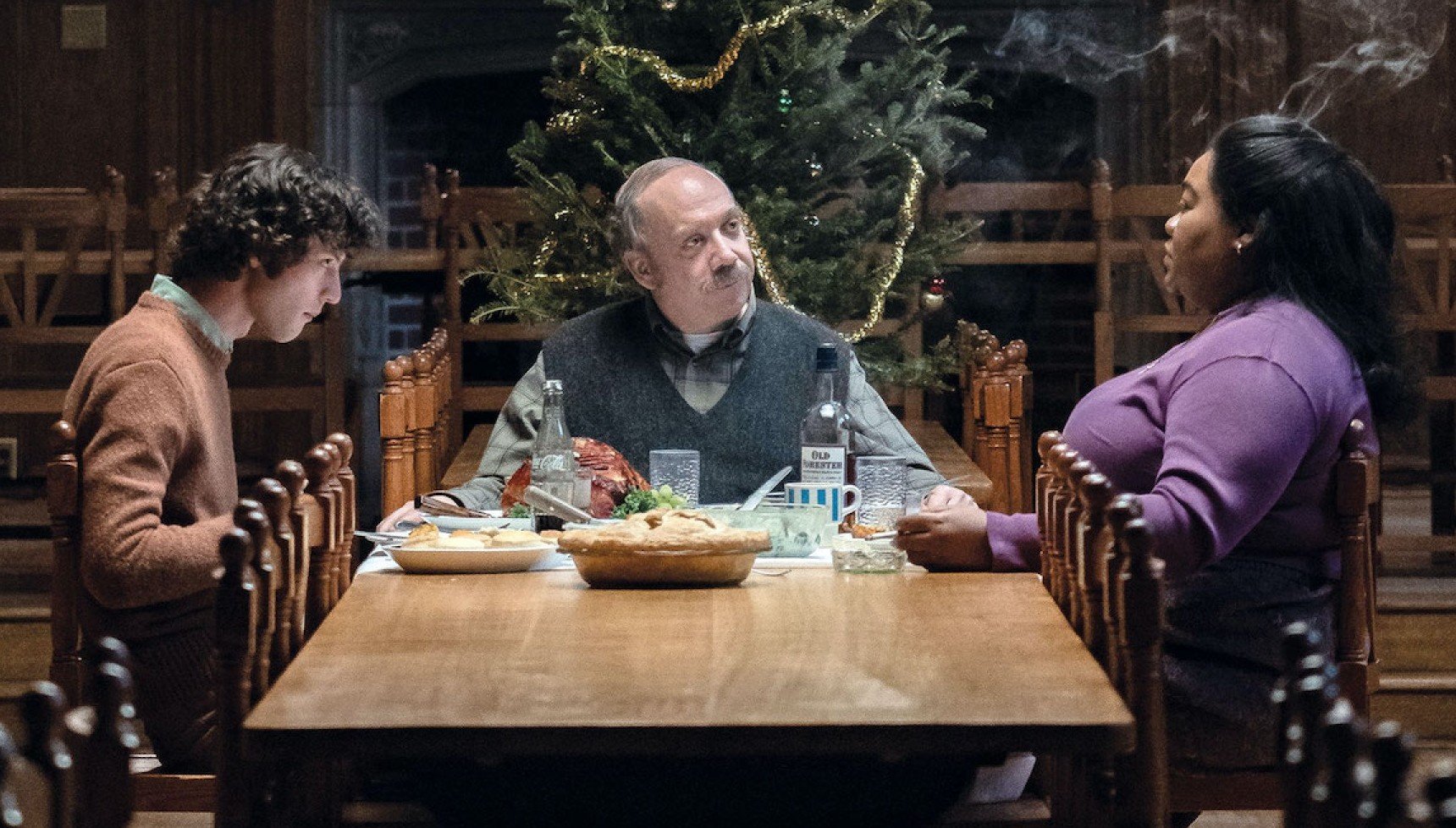Dominic Sessa, Paul Giamatti, and Da'Vine Randolph sitting at a table in The Holdovers