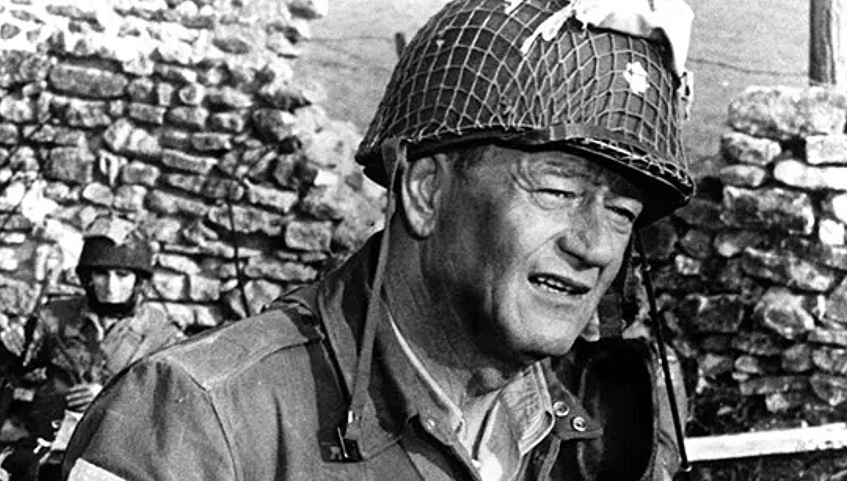 John Wayne in a soldier's uniform in The Longest Day