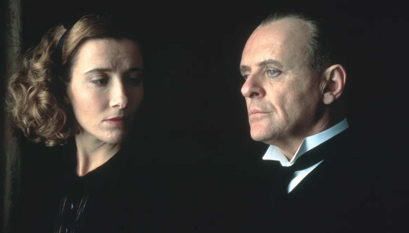 Emma Thompson looking behind her at Anthony Hopkins