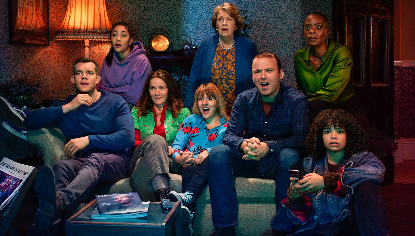 The cast of Years and Years watching TV together