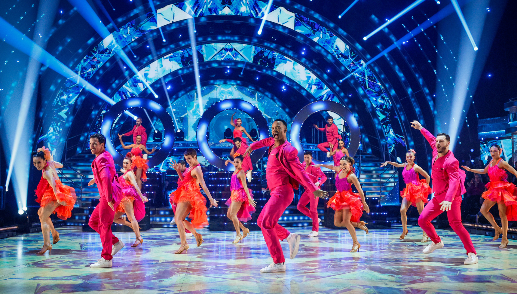 The Strictly pros dancing at the final in pink costumes