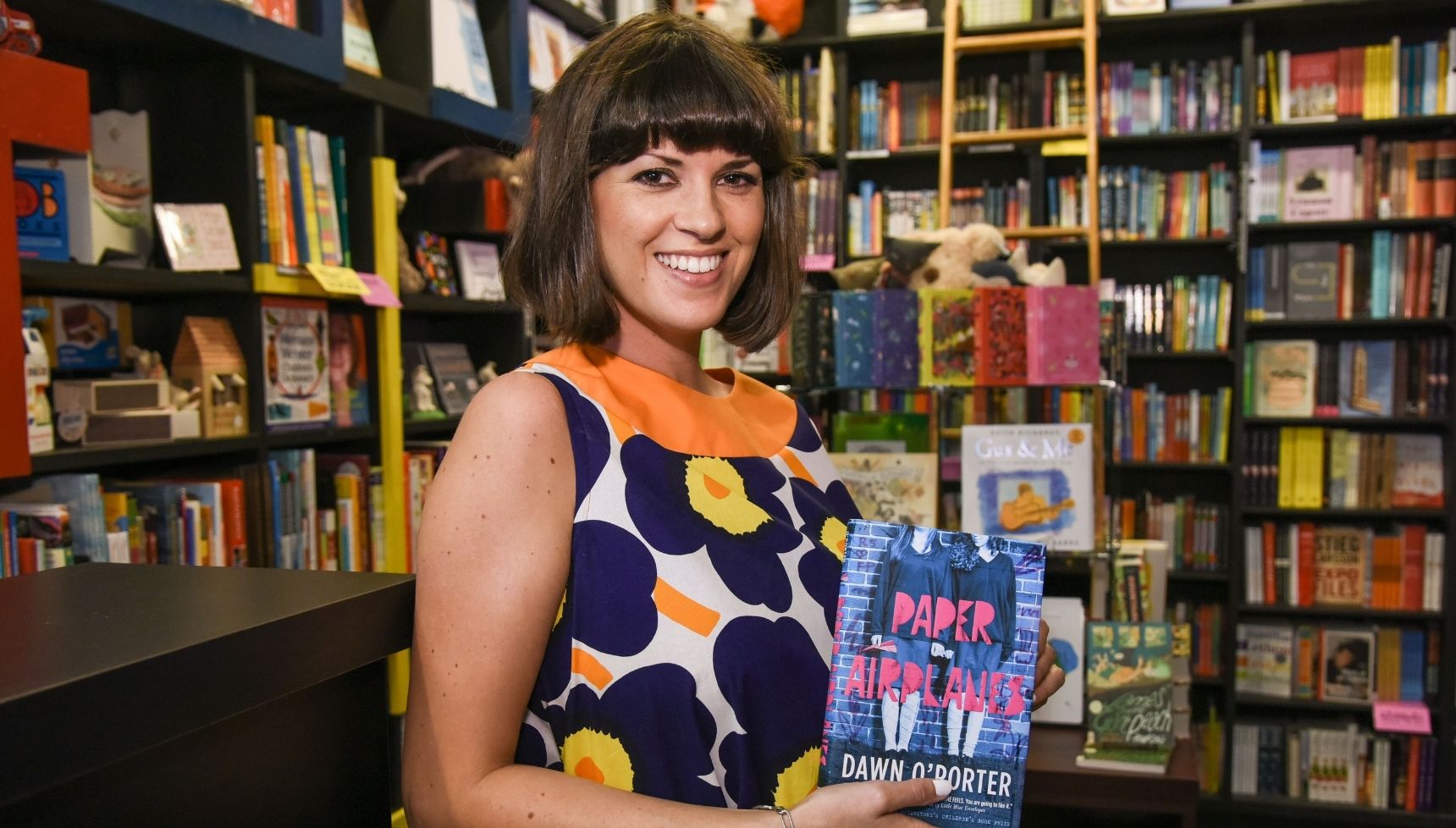 Dawn O'Porter holding a book