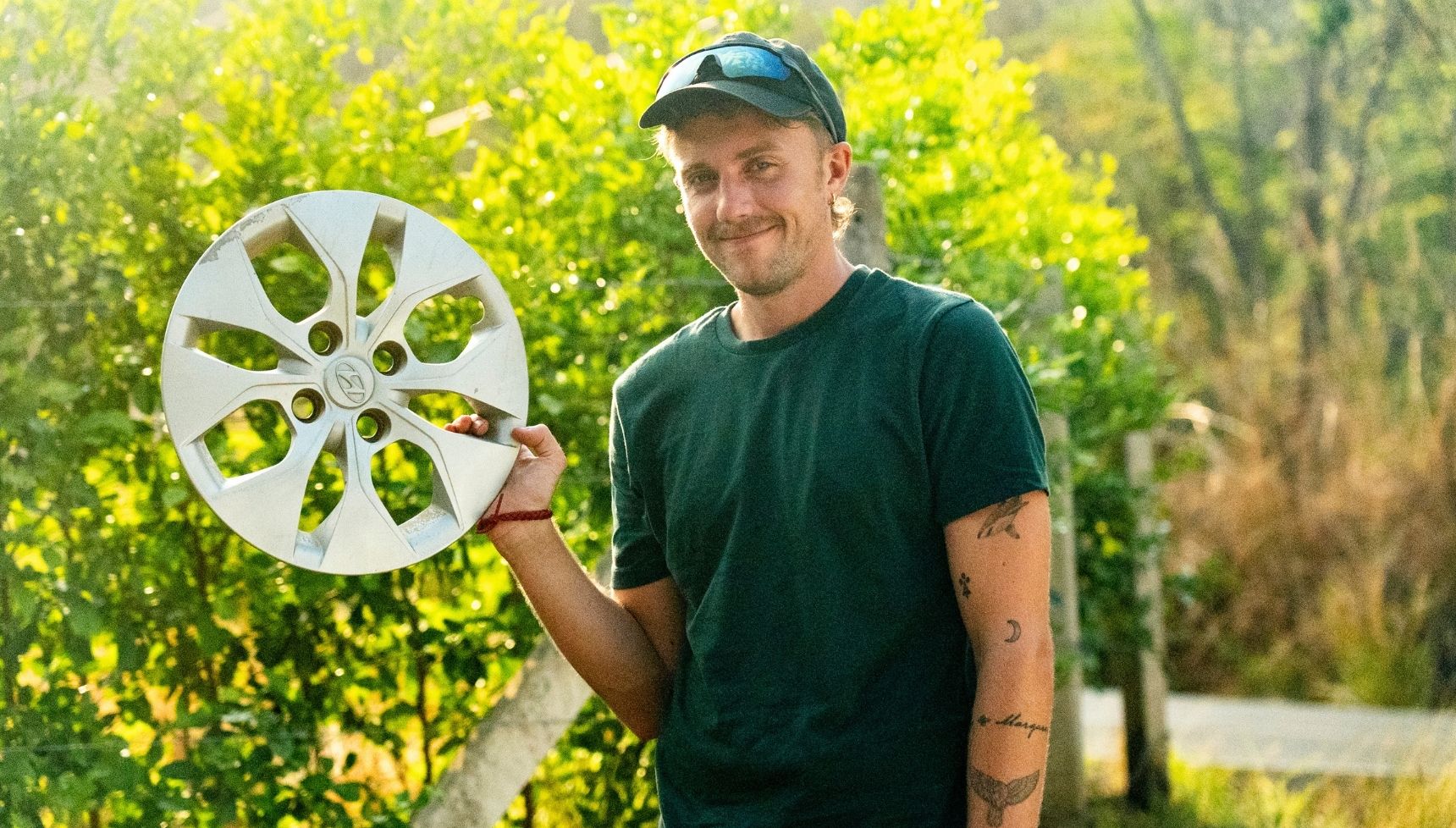 Roman Kemp wears a green shirt