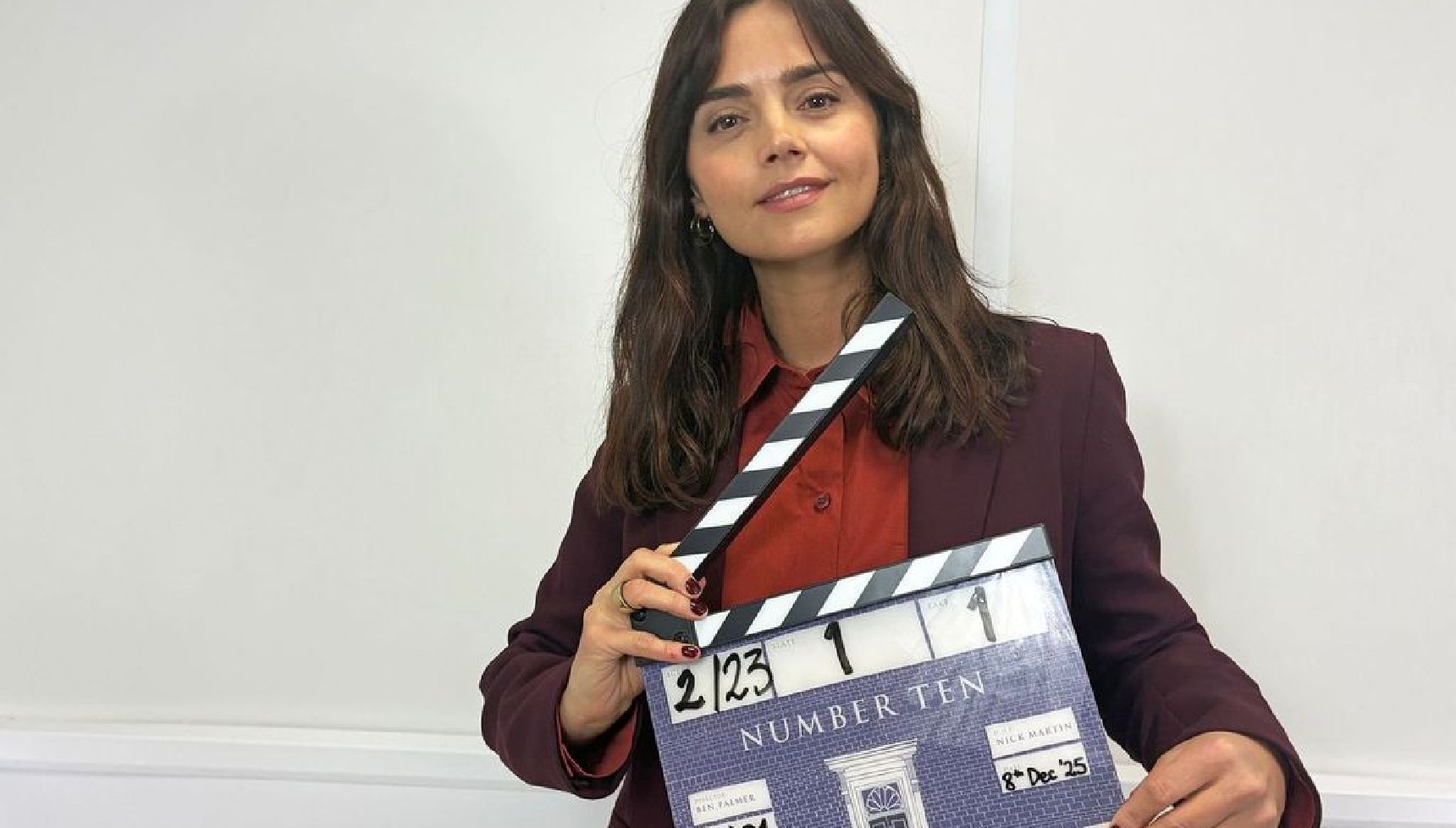 Jenna Louise Coleman with clapperboard for Number 10