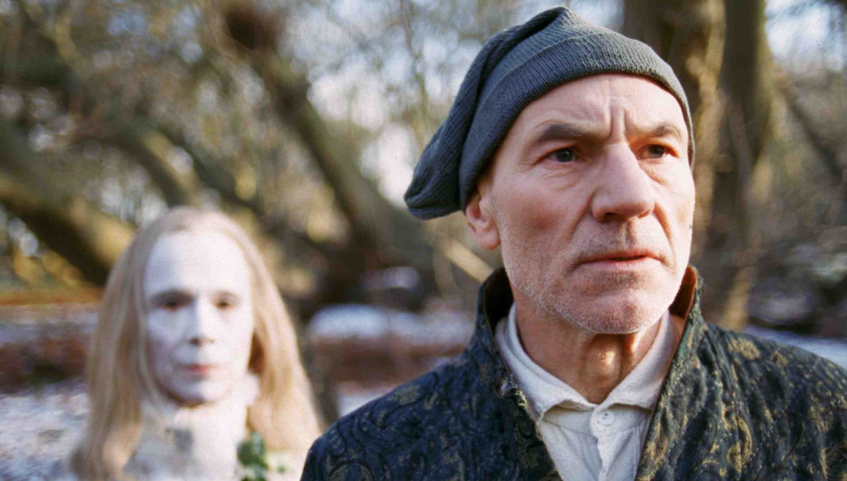 Patrick Stewart's Scrooge standing in front of Joel Grey's ghost in A Christmas Carol