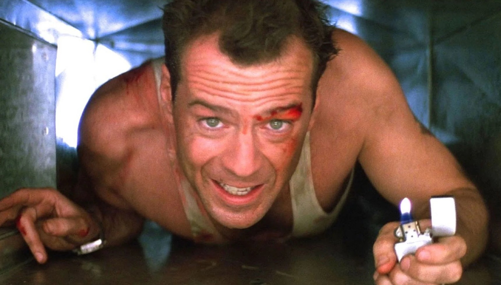 John McClane in an air vent with a lighter in Die Hard