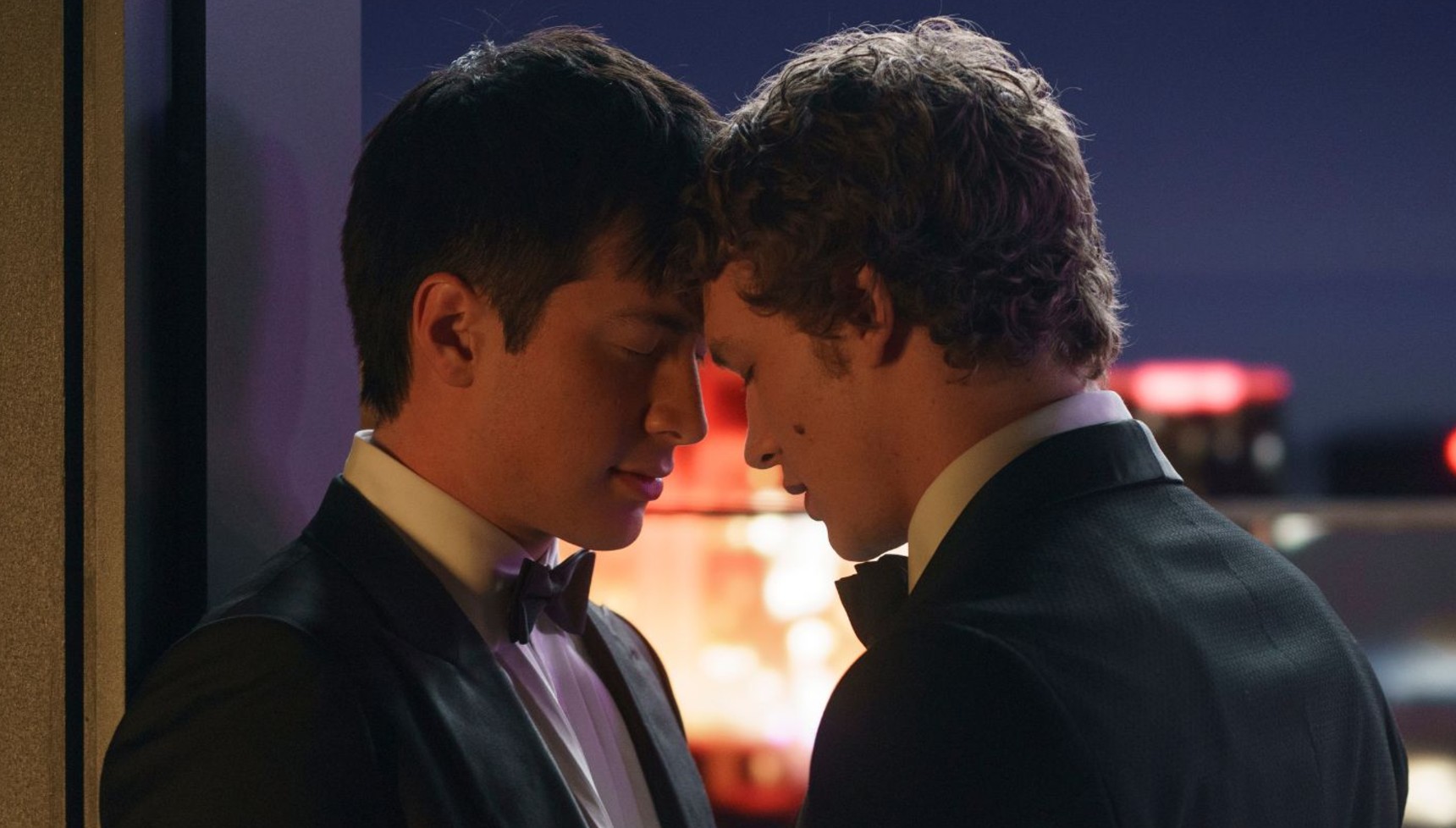 Ilya (Connor Storrie) and Shane (Hudson Williams) with their heads pressed against each other in Heated Rivalry