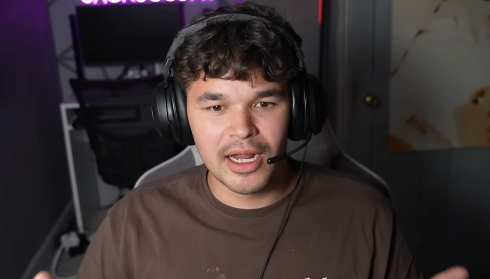 Jack Joseph wearing a headset in a YouTube video