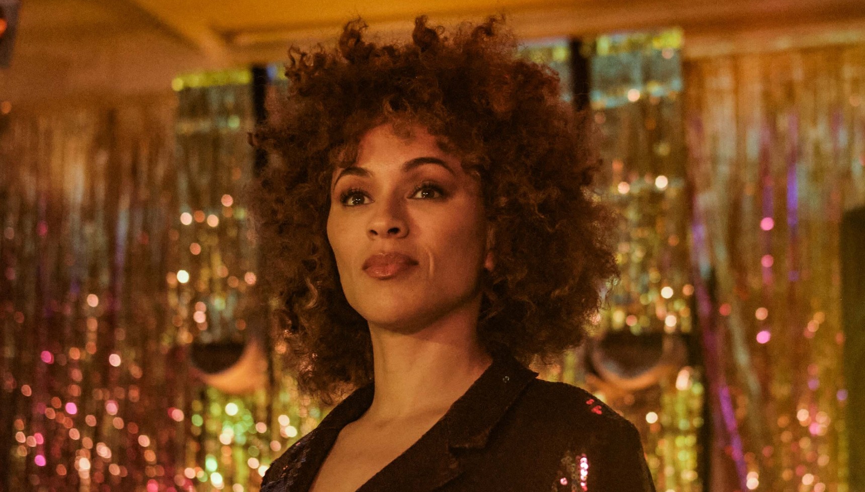 Michelle de Swarte against a gold backdrop in Spent