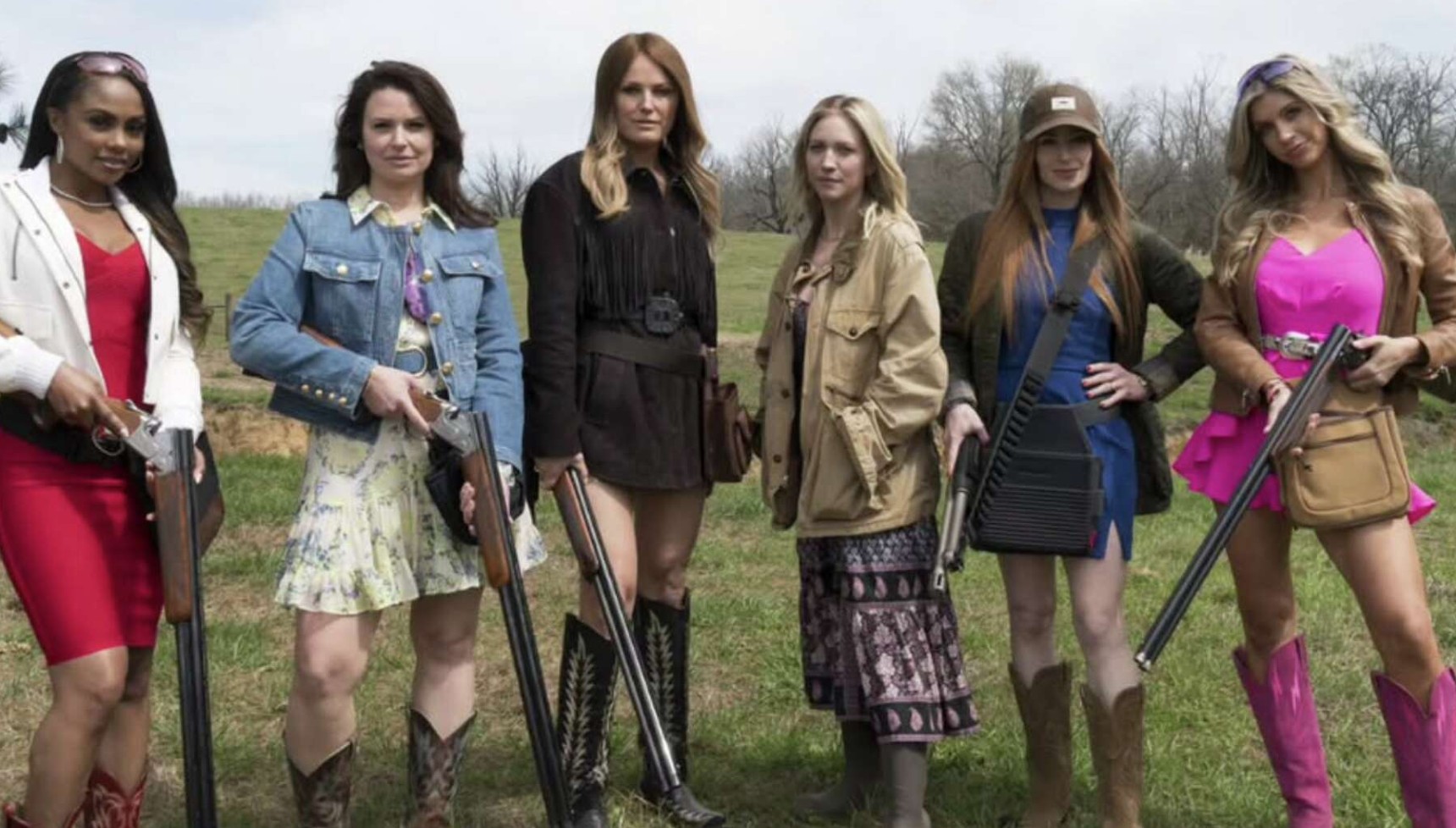 The cast of The Hunting Wives holding rifles