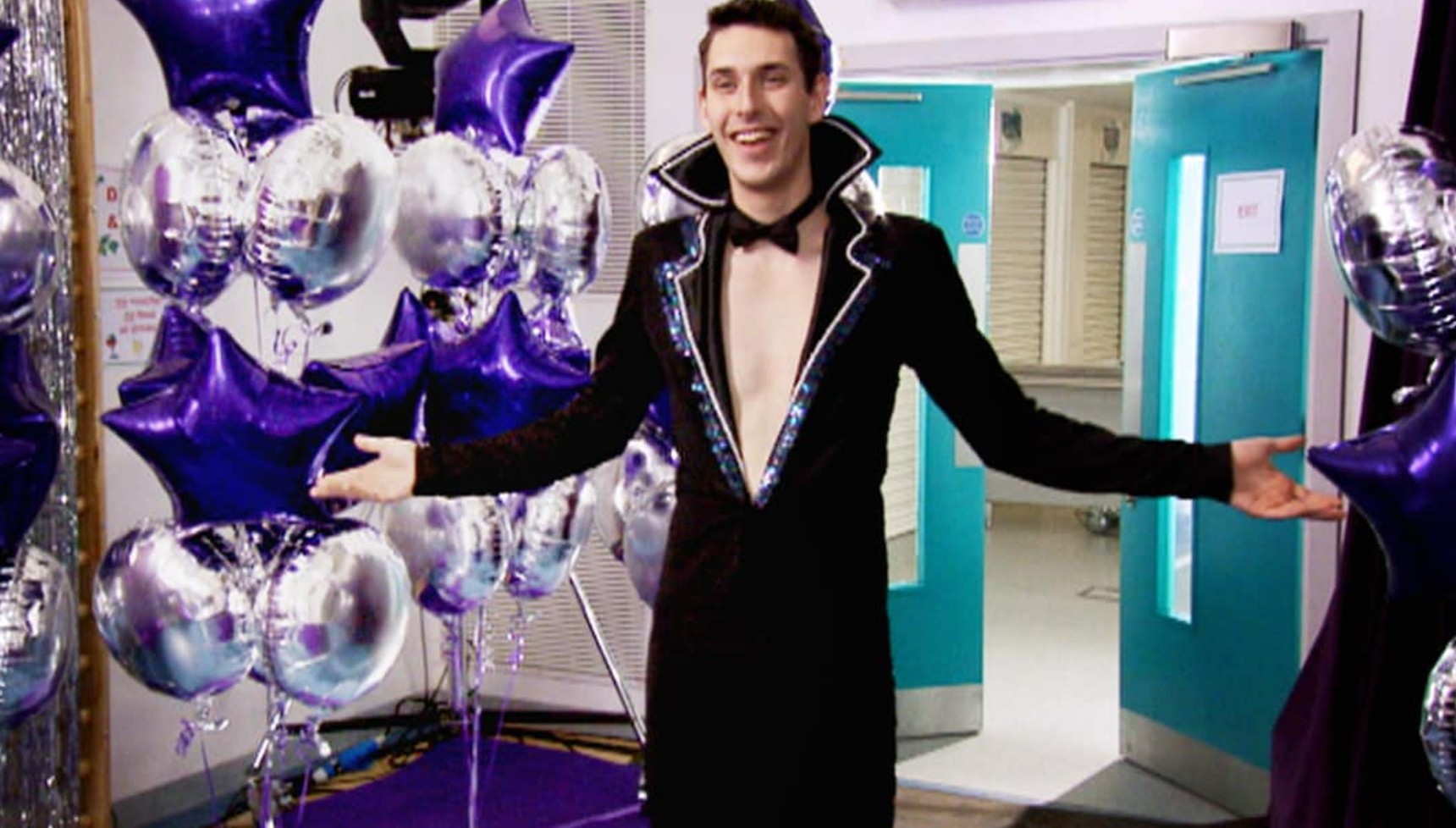 Neil wearing a fancy dress tuxedo in The Inbetweeners