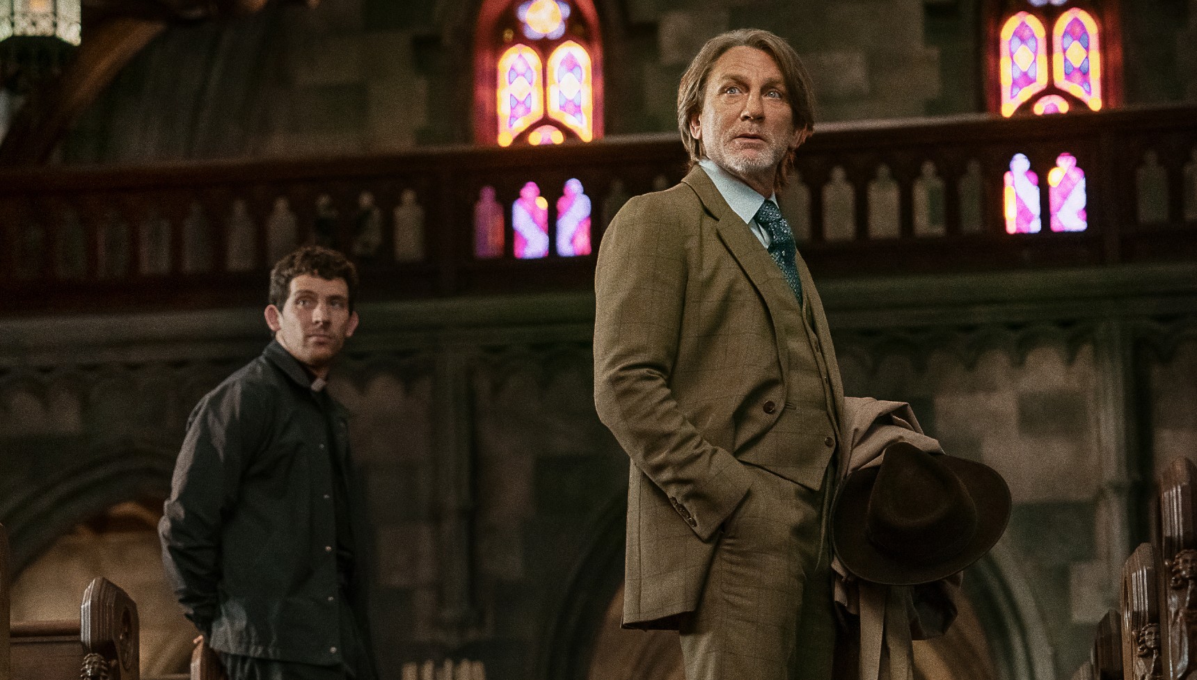 Daniel Craig and Josh O'Connor in church in Wake Up Dead Man 