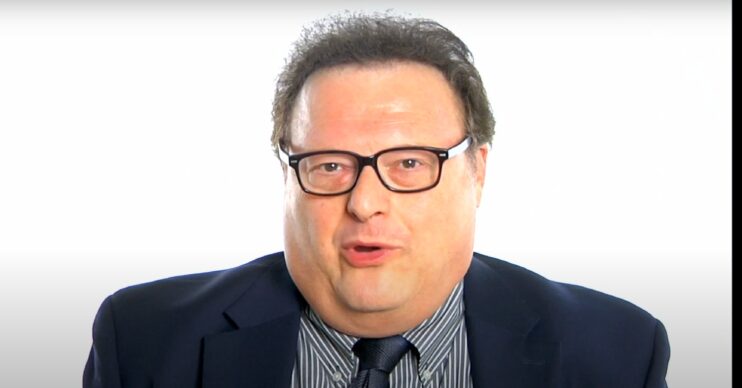 Wayne Knight wears a suit
