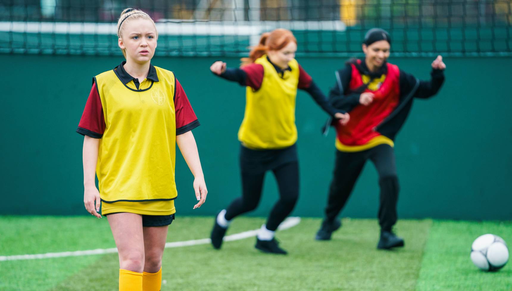 Portia playing football in Waterloo Road
