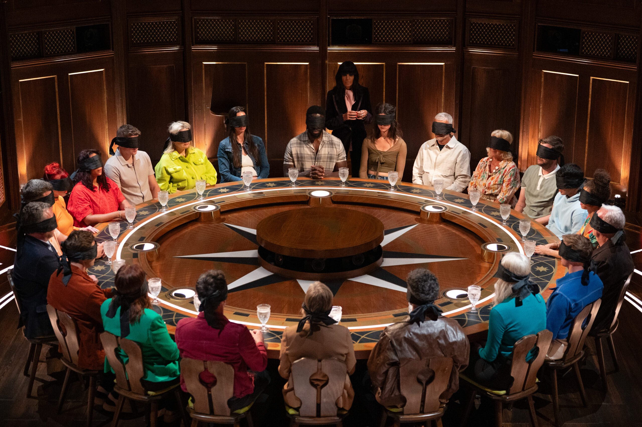 The cast of The Traitors around the roundtable