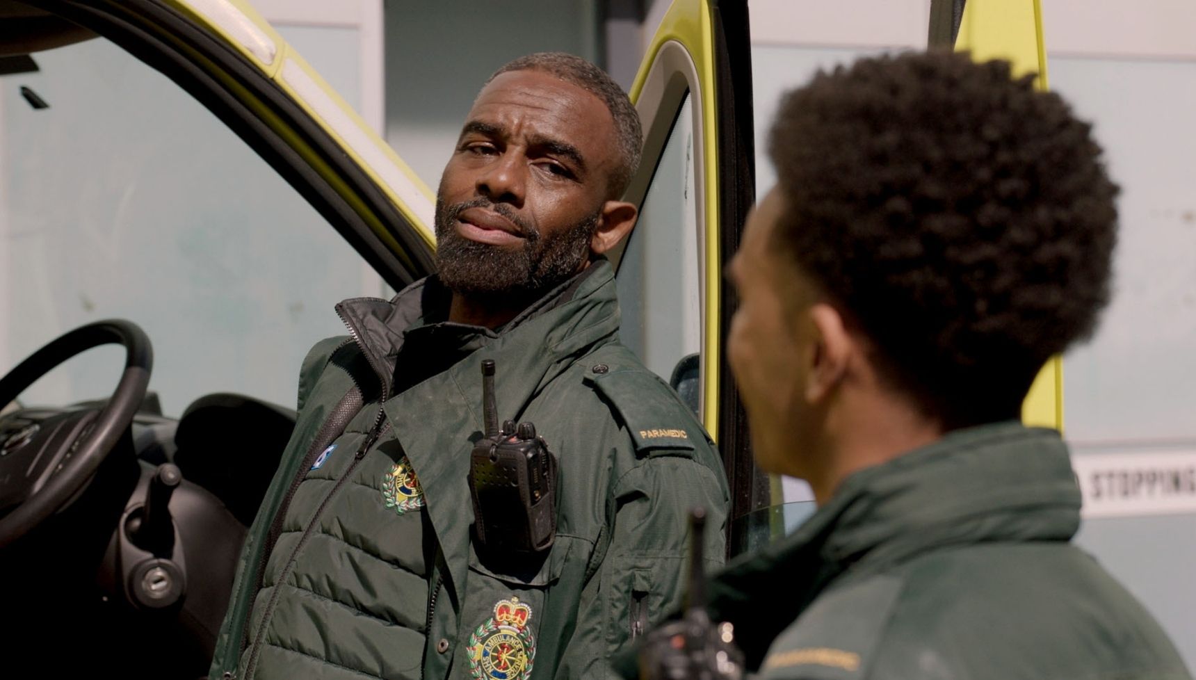 Jacob smiles at Teddy as he talks about his date in Casualty