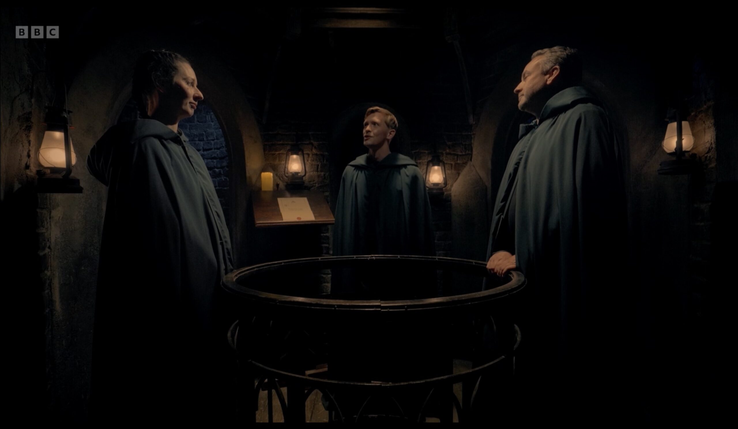 The Traitors in their black cloaks 