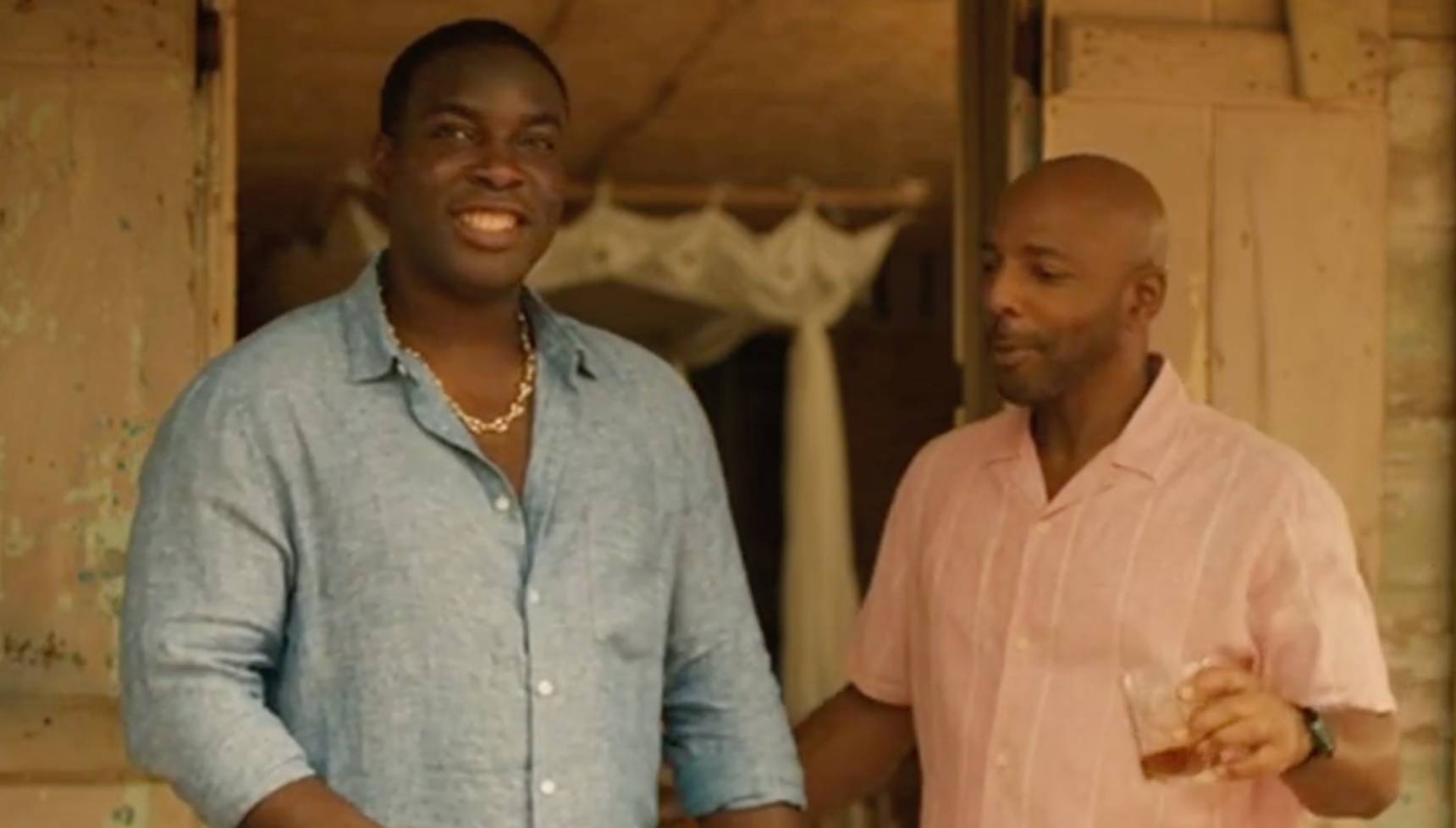 Solomon and Mervin share a drink in Death in Paradise