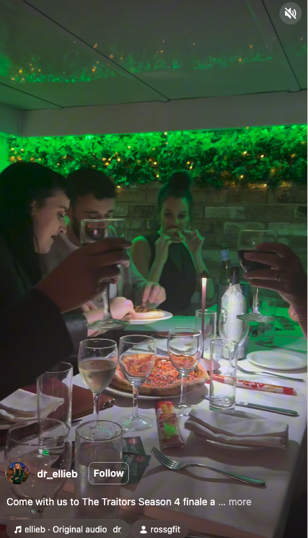 Roxy eating pizza at the Traitors wrap party