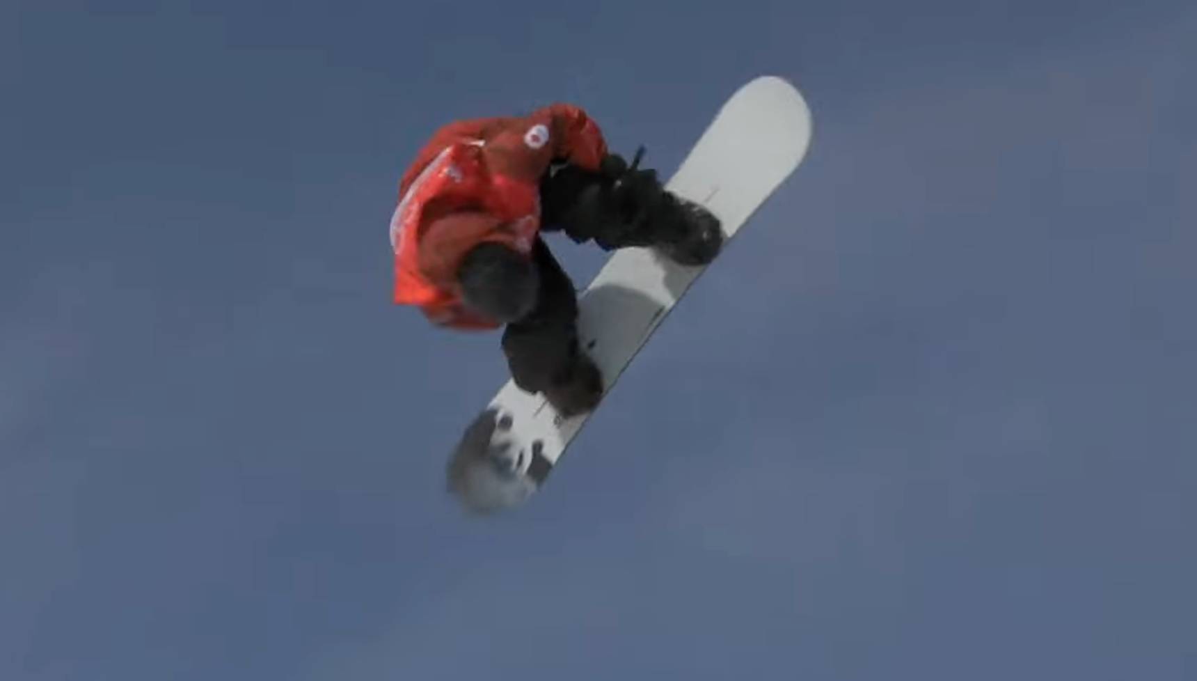 Snowboarder flying through air