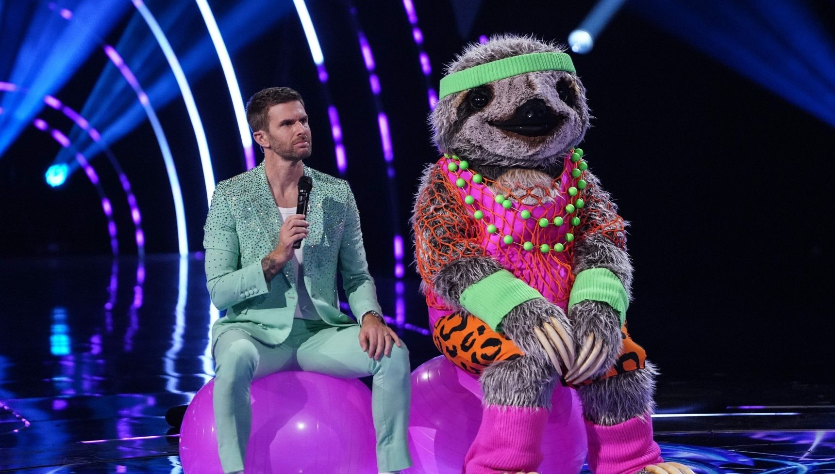 Joel Dommett and unknown celebrity on The Masked Singer 