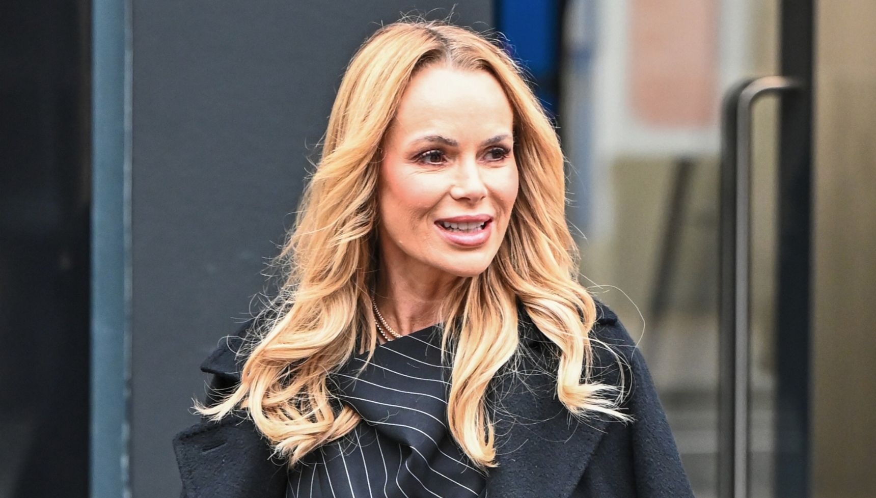 Amanda Holden outside walking 