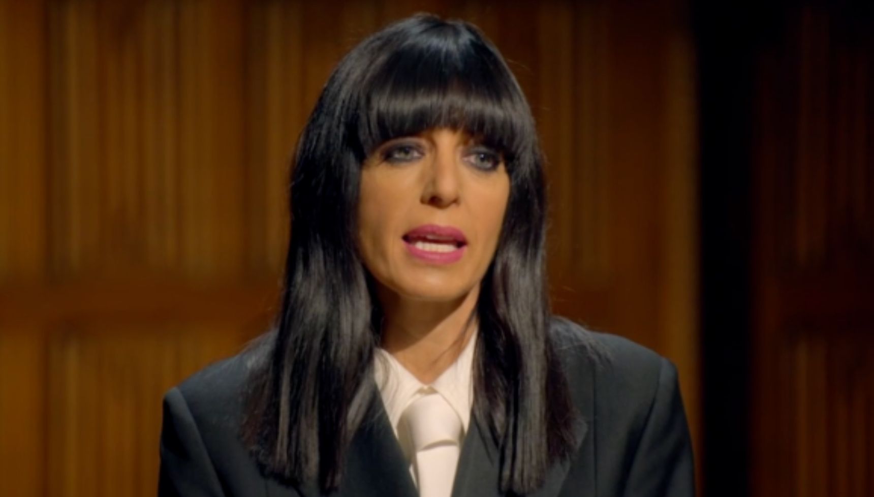 Claudia Winkleman on The Traitors in pink lipstick