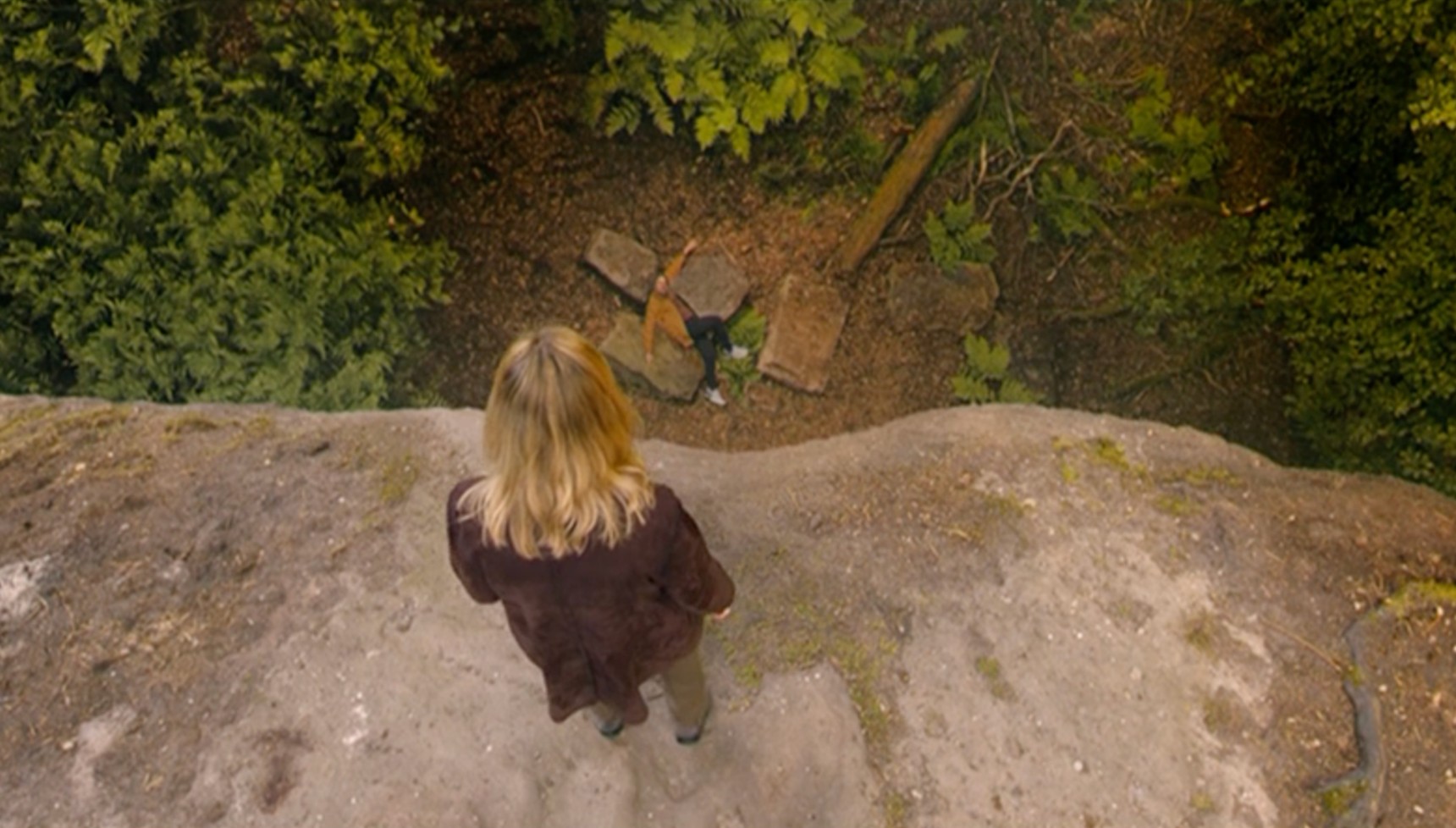 Jo standing over the body over her dead husband Pat in After the Flood