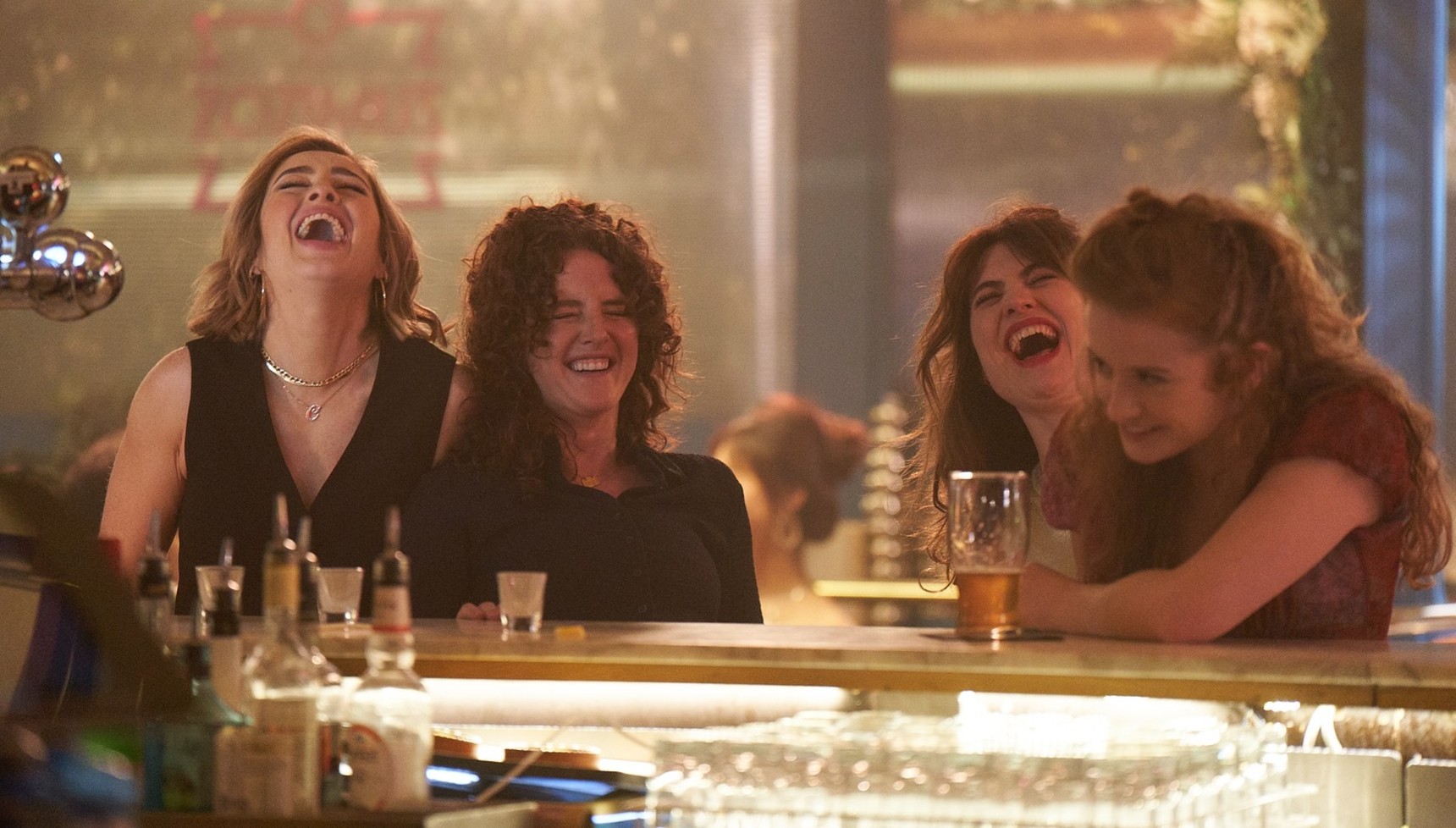 The Walsh Sisters laughing in a bar