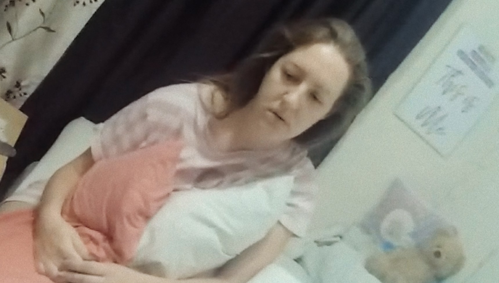 Lucy Letby sitting with two pillows