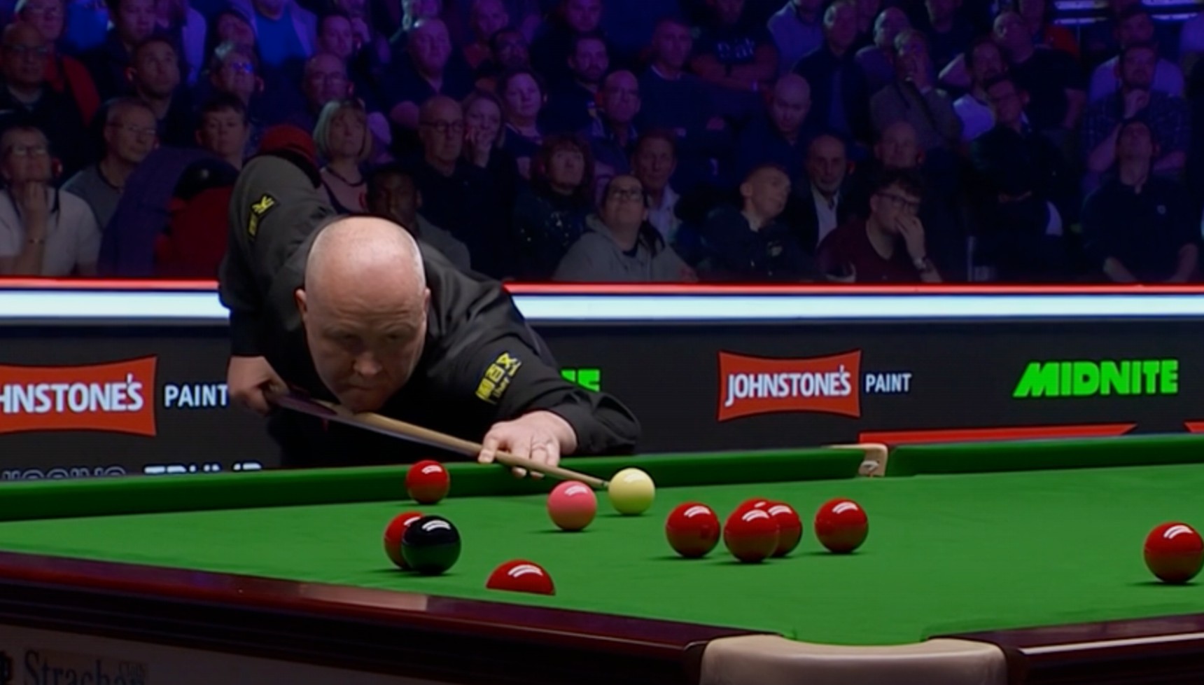 John Higgins playing in the 2026 Masters snooker tournament