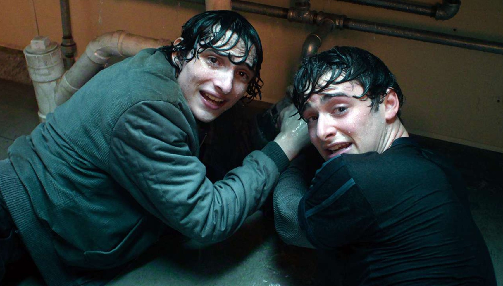 Mike and Will holding a leaking pipe in Stranger Things season 5 volume 1