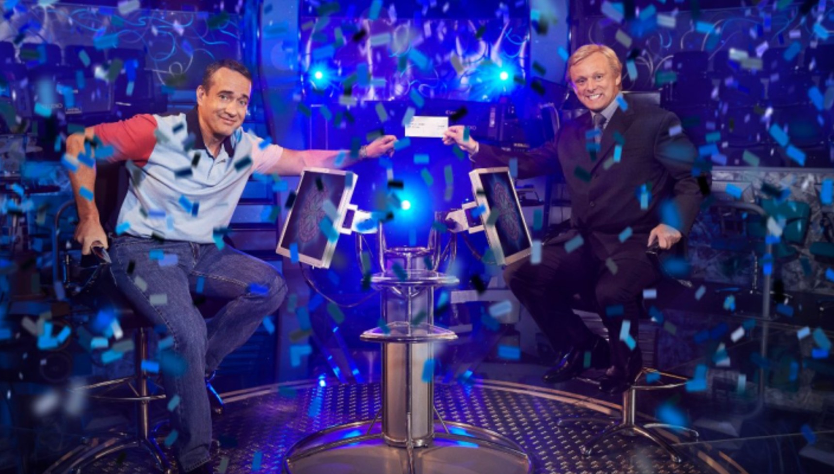 Matthew Macfadyen holding a check with Michael Sheen in Quiz