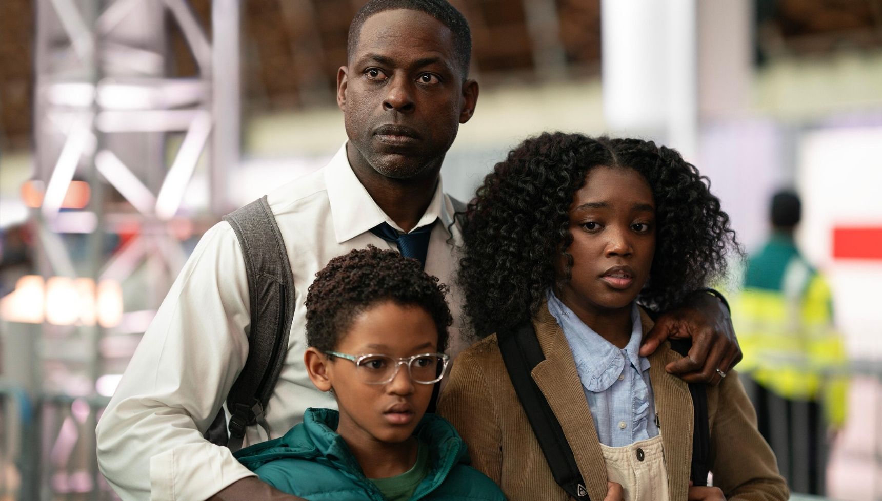 Sterling K Brown as Xavier, alongside his two kids 