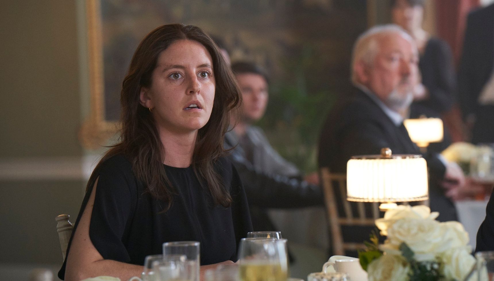 Louisa Harland as Anna at a funeral