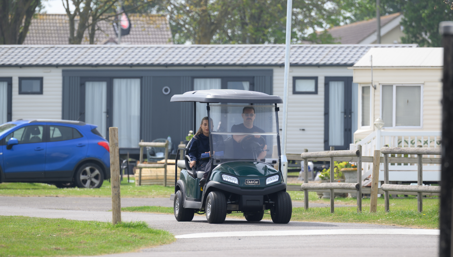 Danny and Dani Dyer in a golf buggy