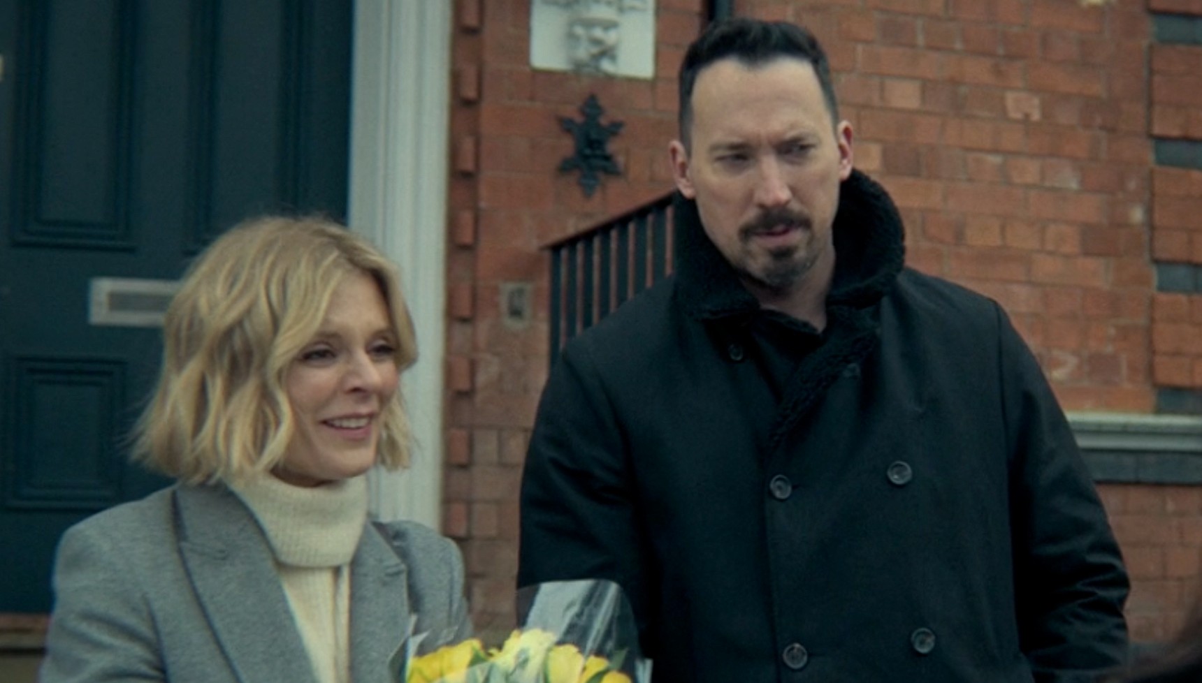 Nikki holding flowers next to Jack in Silent Witness