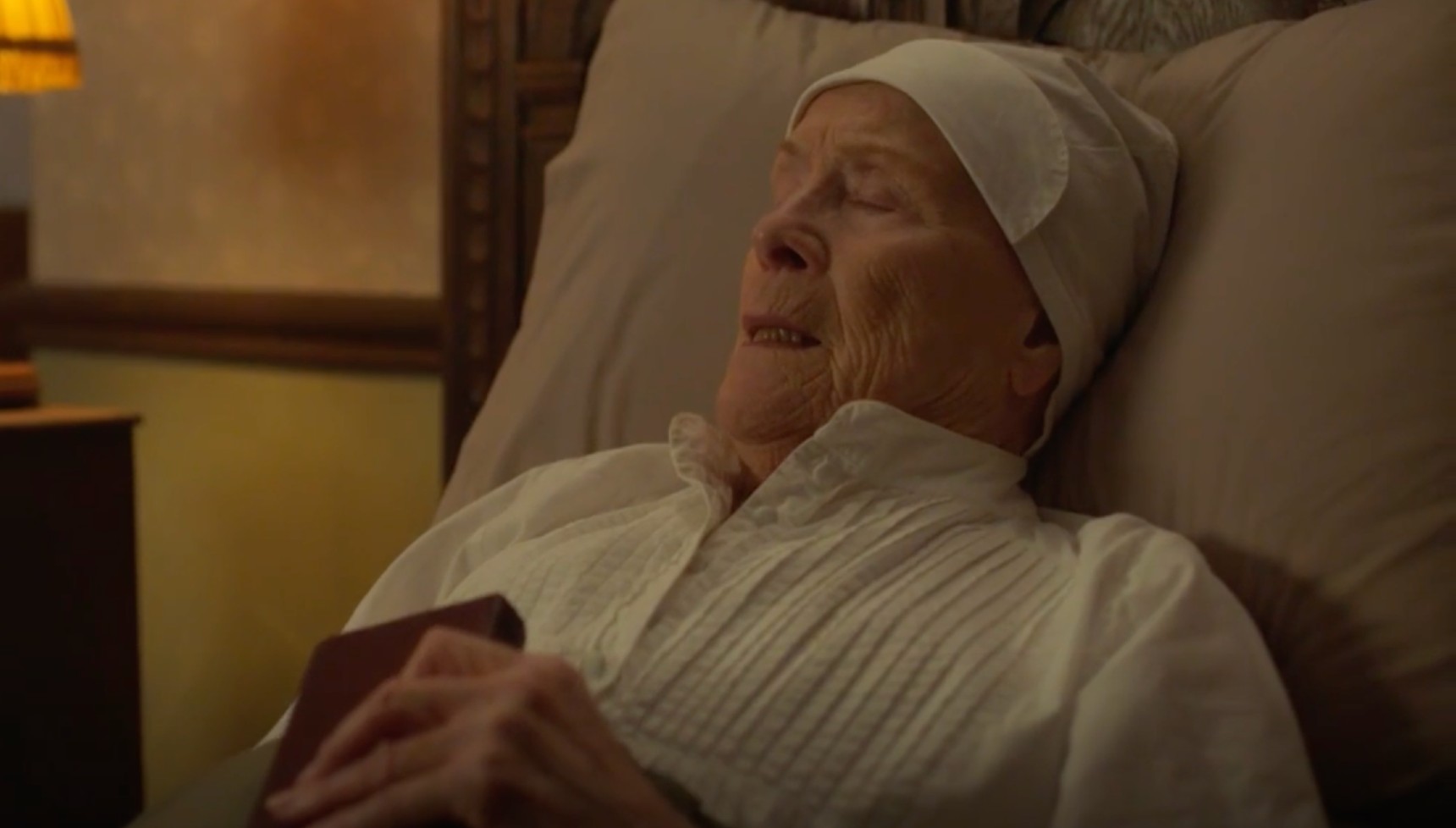Sister Monica Joan lying in bed with eyes closed
