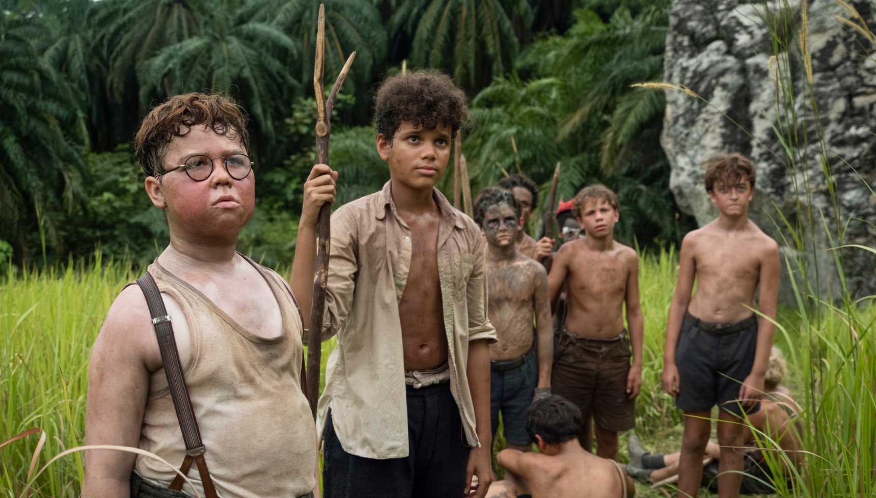 Piggy, Ralph, and the other boys in Lord of the Flies