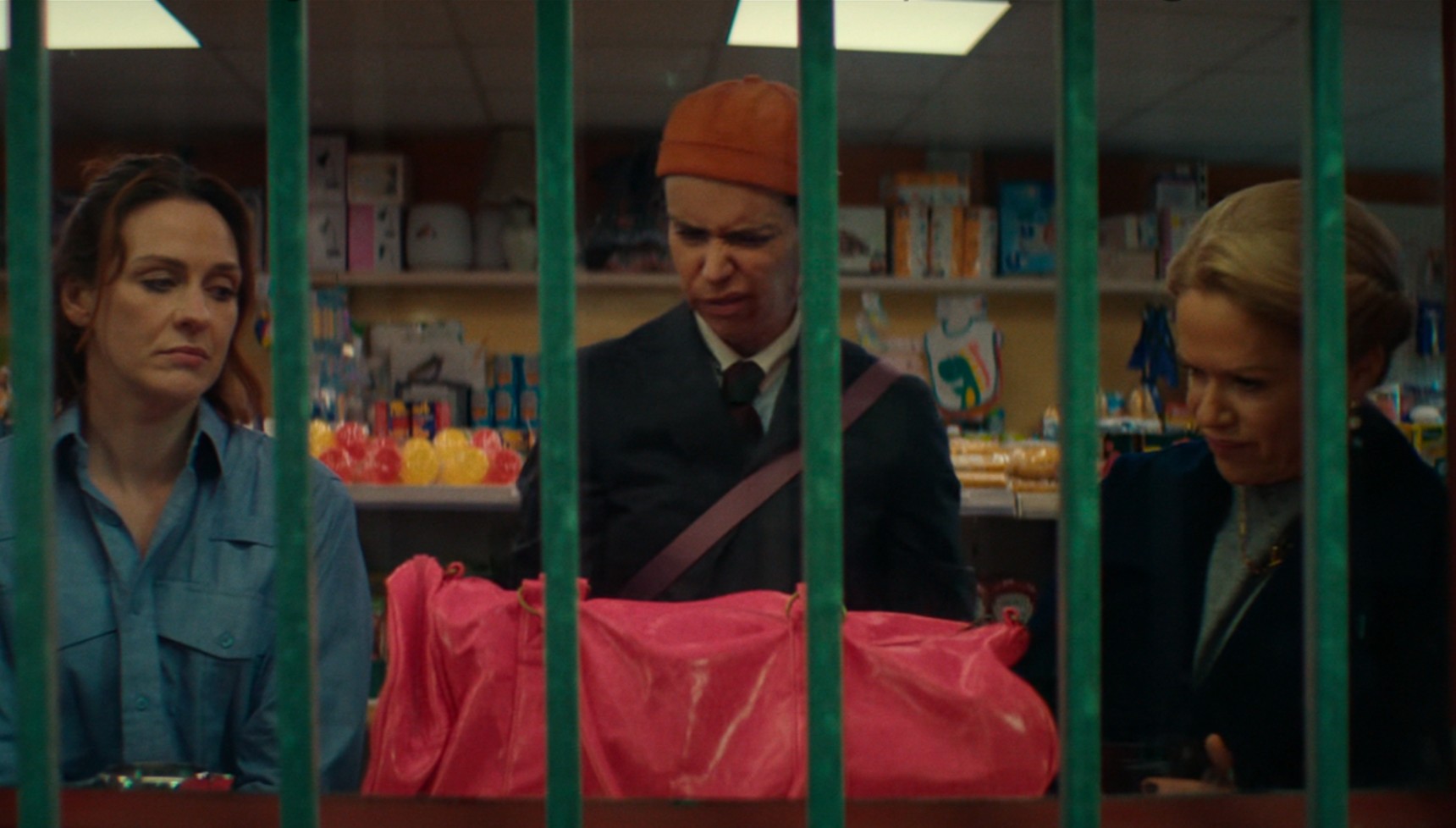 Saoirse, Robyn, and Dara with the pink bag at the end of How to Get to Heaven from Belfast