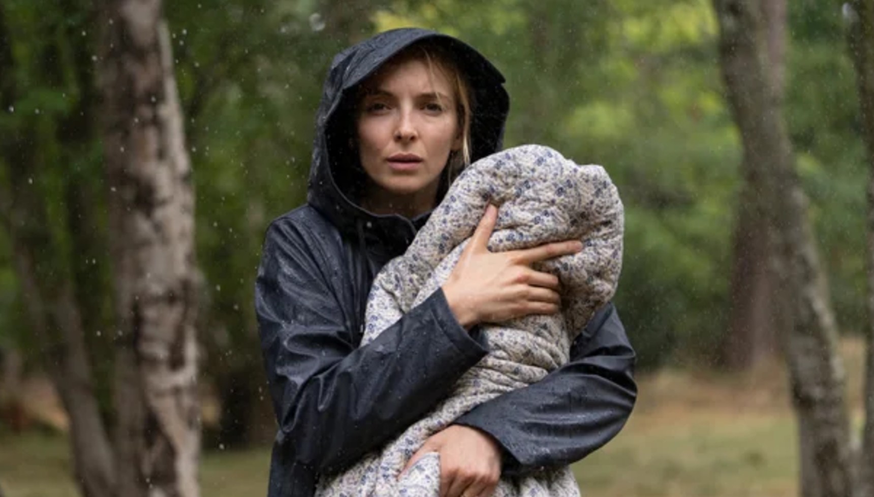Jodie Comer holding a baby in The End We Start From