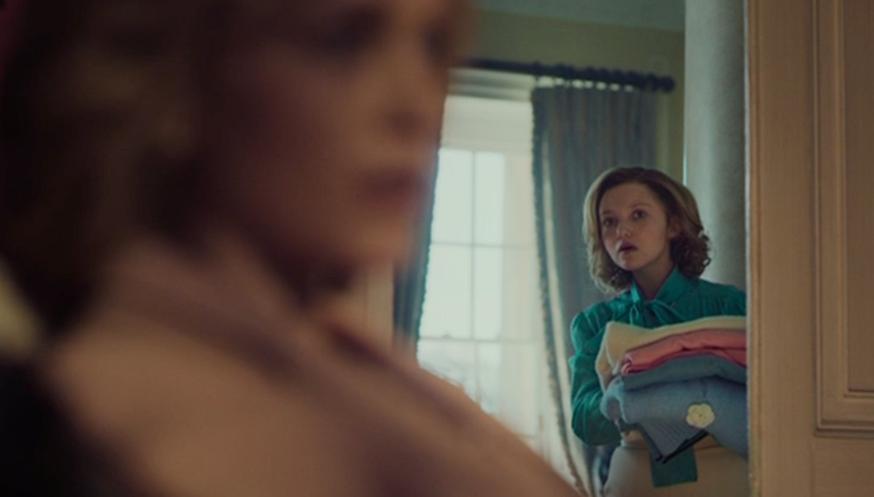 Mia McKenna-Bruce's Jane Andrews looking at Princess Diana in The Lady