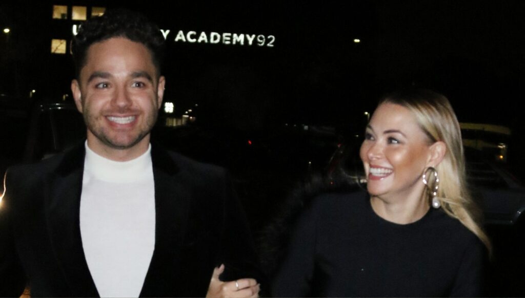 Adam and his wife outside