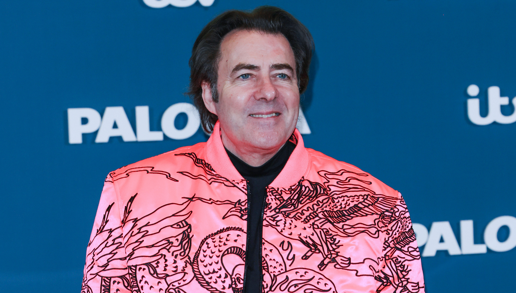 Jonathan Ross in a pink jacket