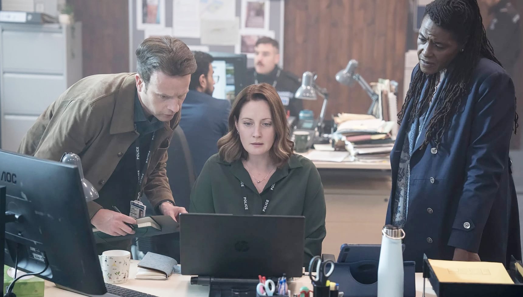 Charlotte McCurry as DC Kate Trent (centre) in Ellis