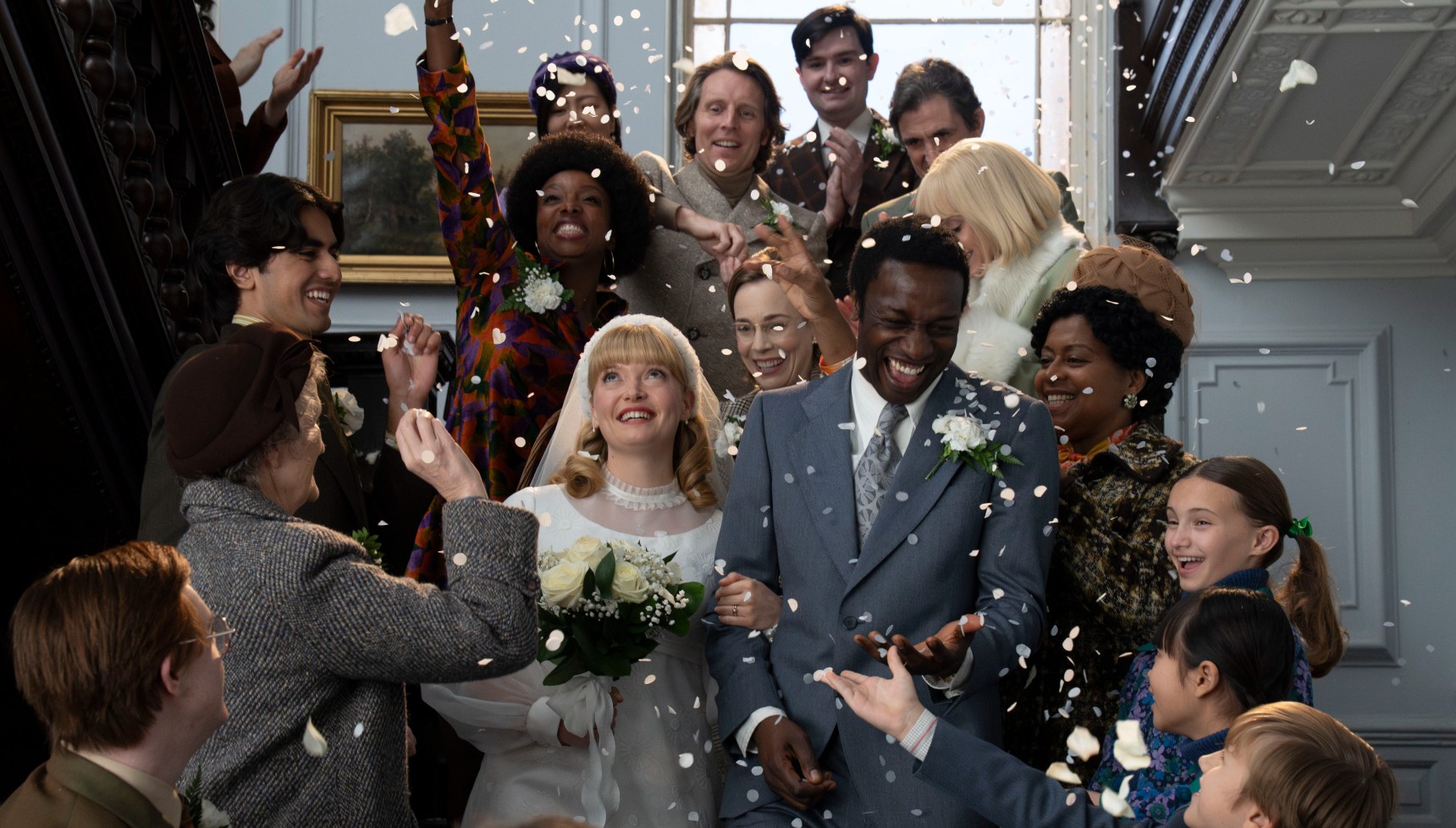 Confetti rains down on Cyril and Rosalind at their wedding