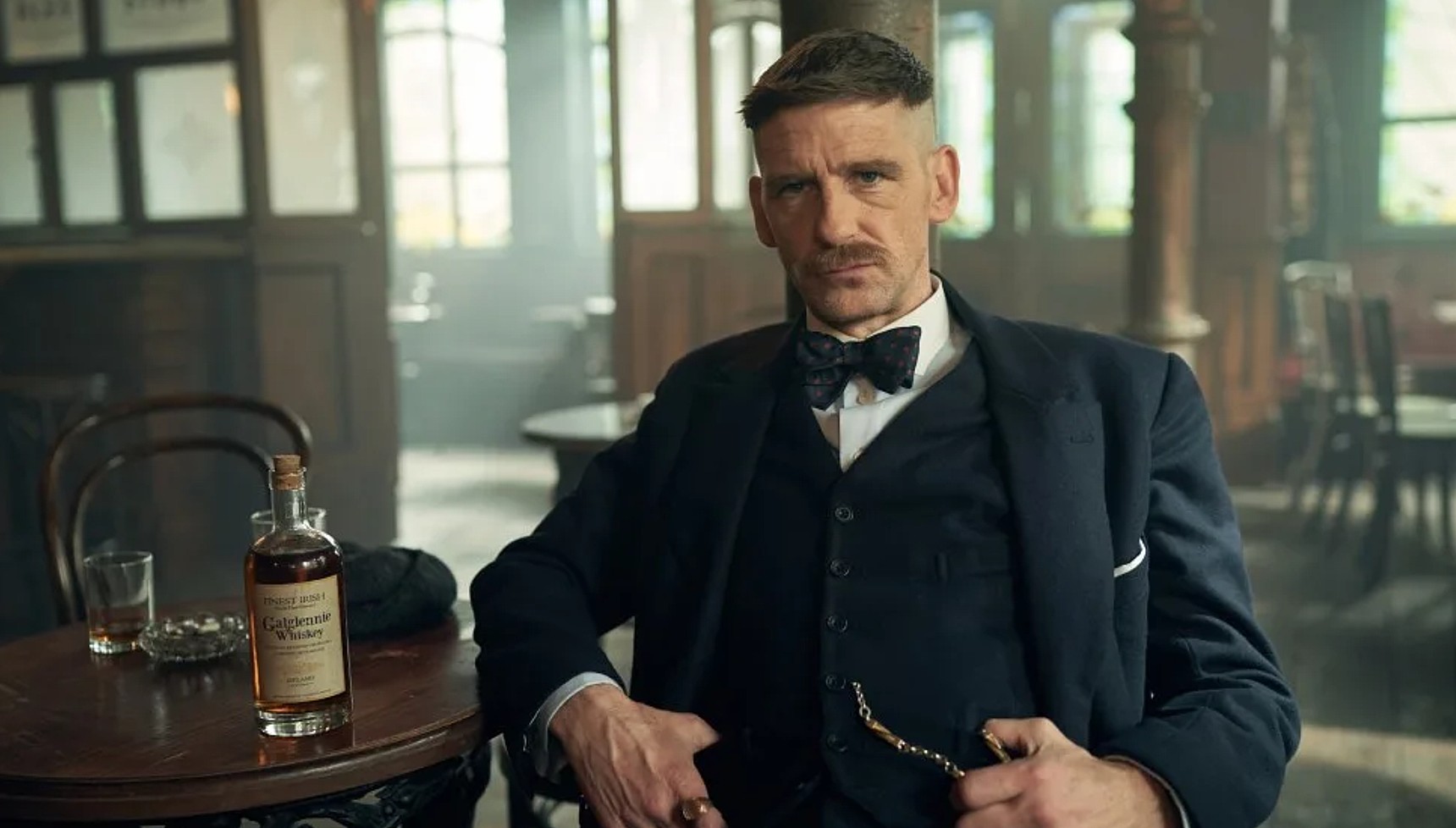 Arthur sitting in the Garrison in Peaky Blinders