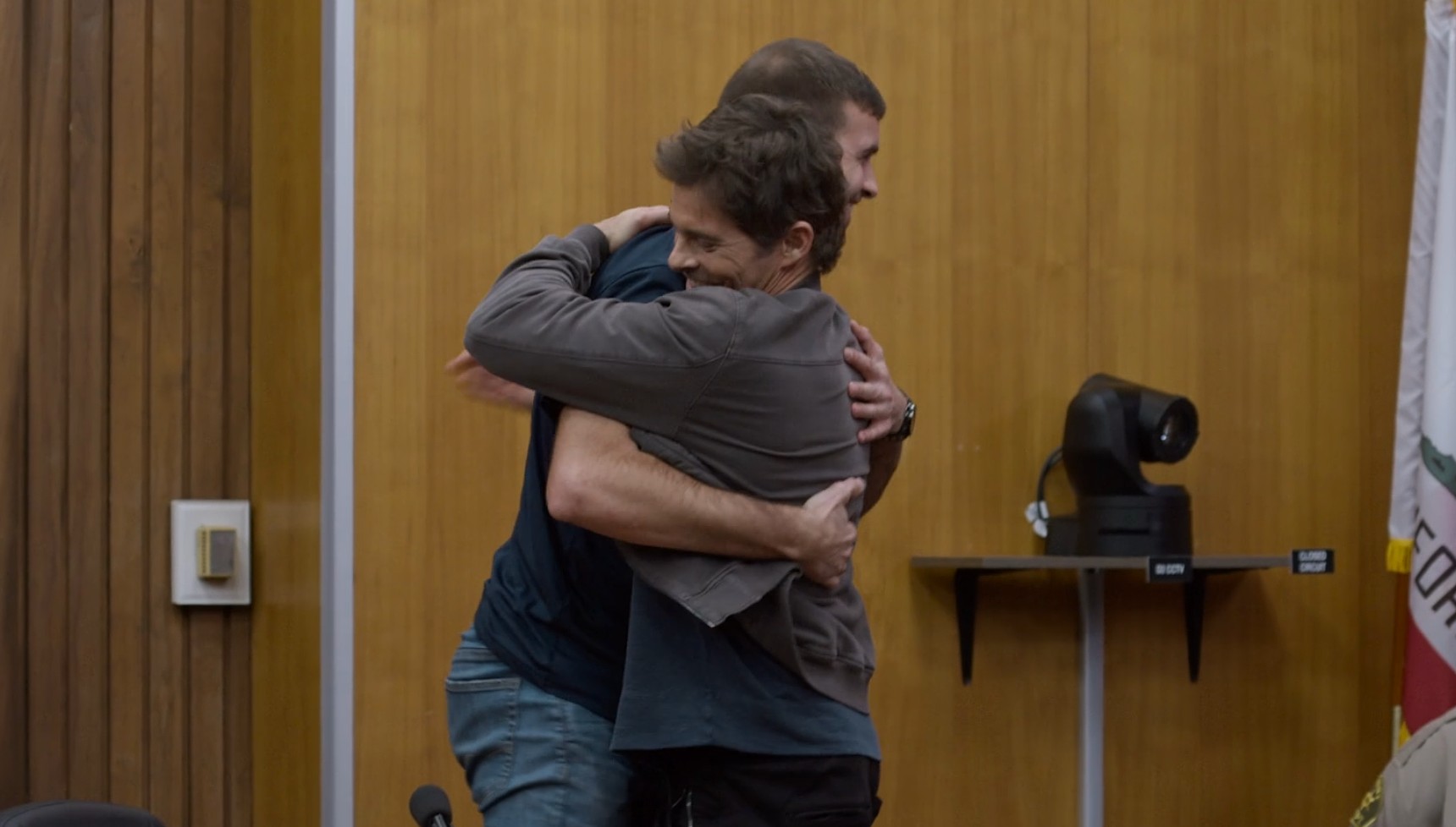 James Marsden hugging Ronald Gladden