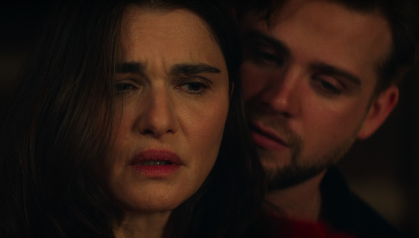 Leo Woodall standing behind Rachel Weisz in Vladimir